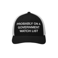 Mesh trucker cap with PROBABLY ON A GOVERNMENT WATCH LIST embroidered on the front, representing a bold statement of activism