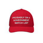Red trucker-style baseball cap titled Watch List Hat with white embroidered text: “PROBABLY ON A GOVERNMENT WATCH LIST,” 